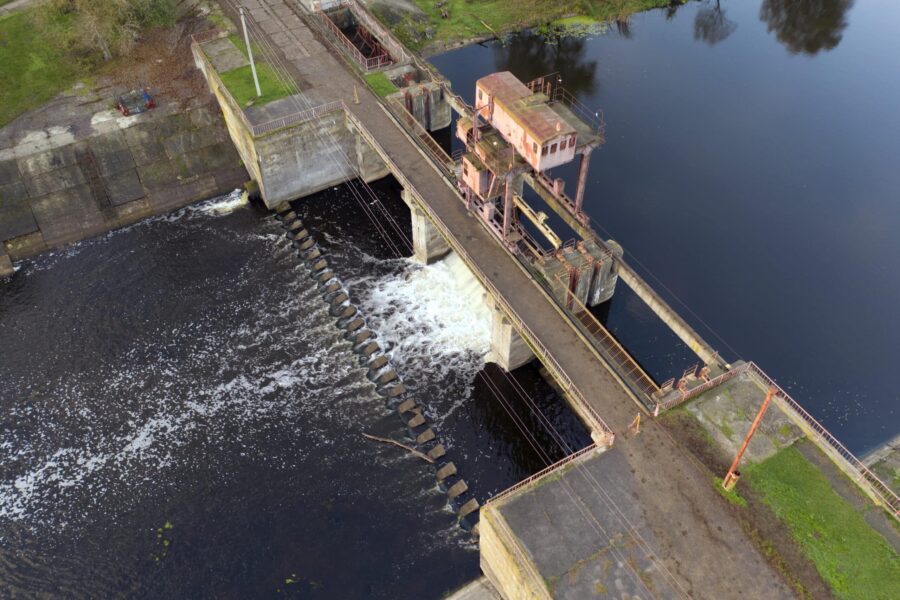 Hydroelectric power station on a small river. Renewable energy source.